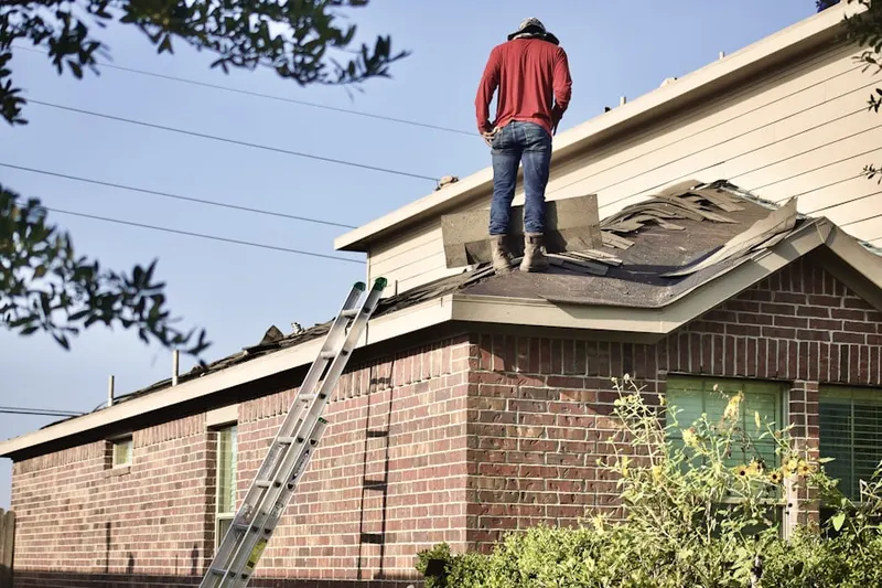 Professional roofer working on a residential roof in Ole Salem Estates